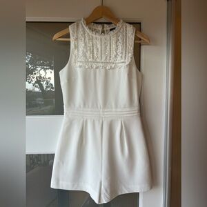 Topshop cute, sexy and floral white sleeveless romper.
